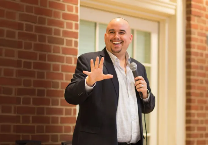 man smiling while speaking 1